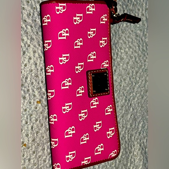 Dooney & Bourke Other - Dooney and Bourke pink monogram zip around wallet.